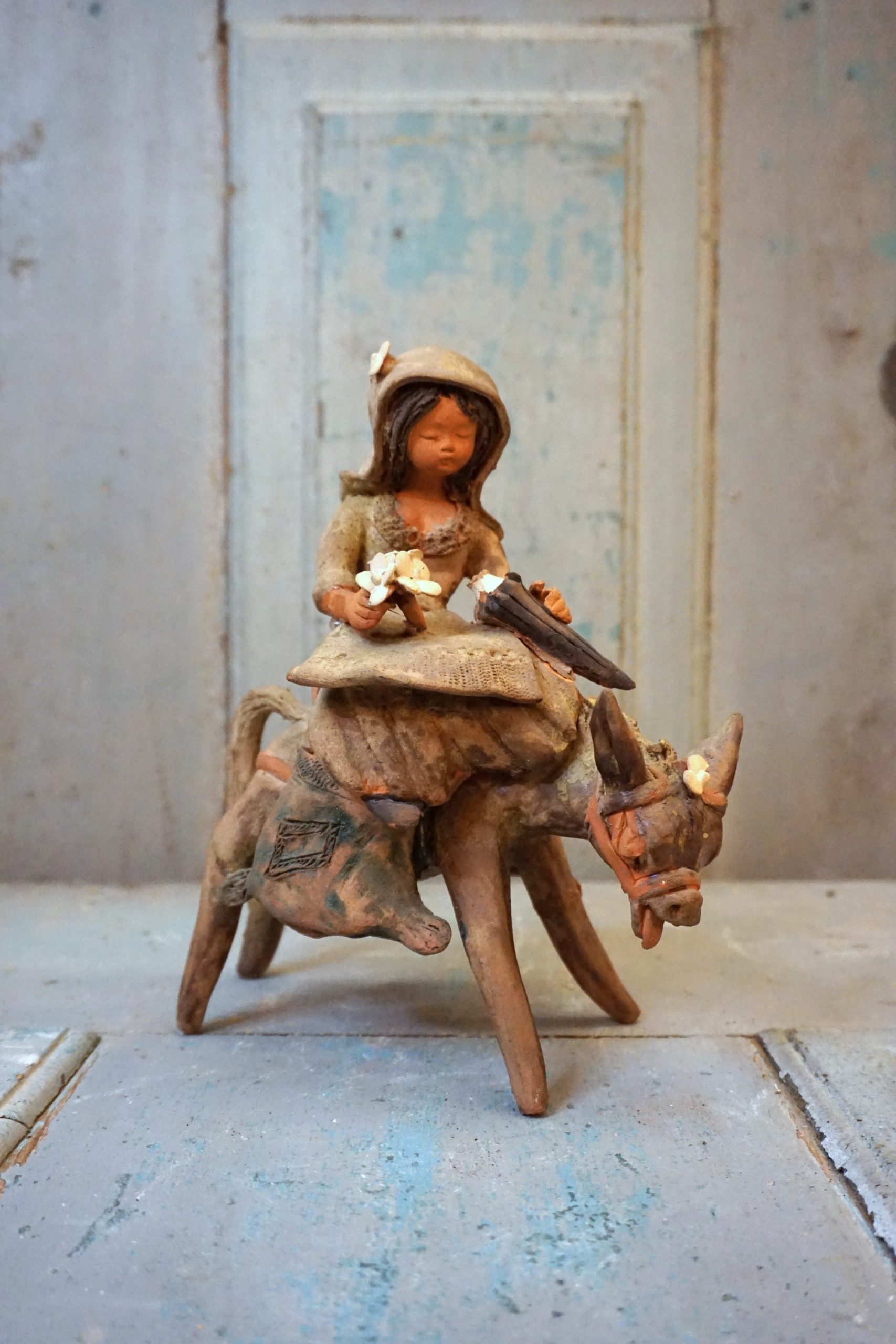 Girl crying with loaded donkey - José Franco