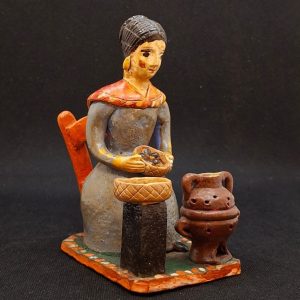 Mulher a assar castanhas